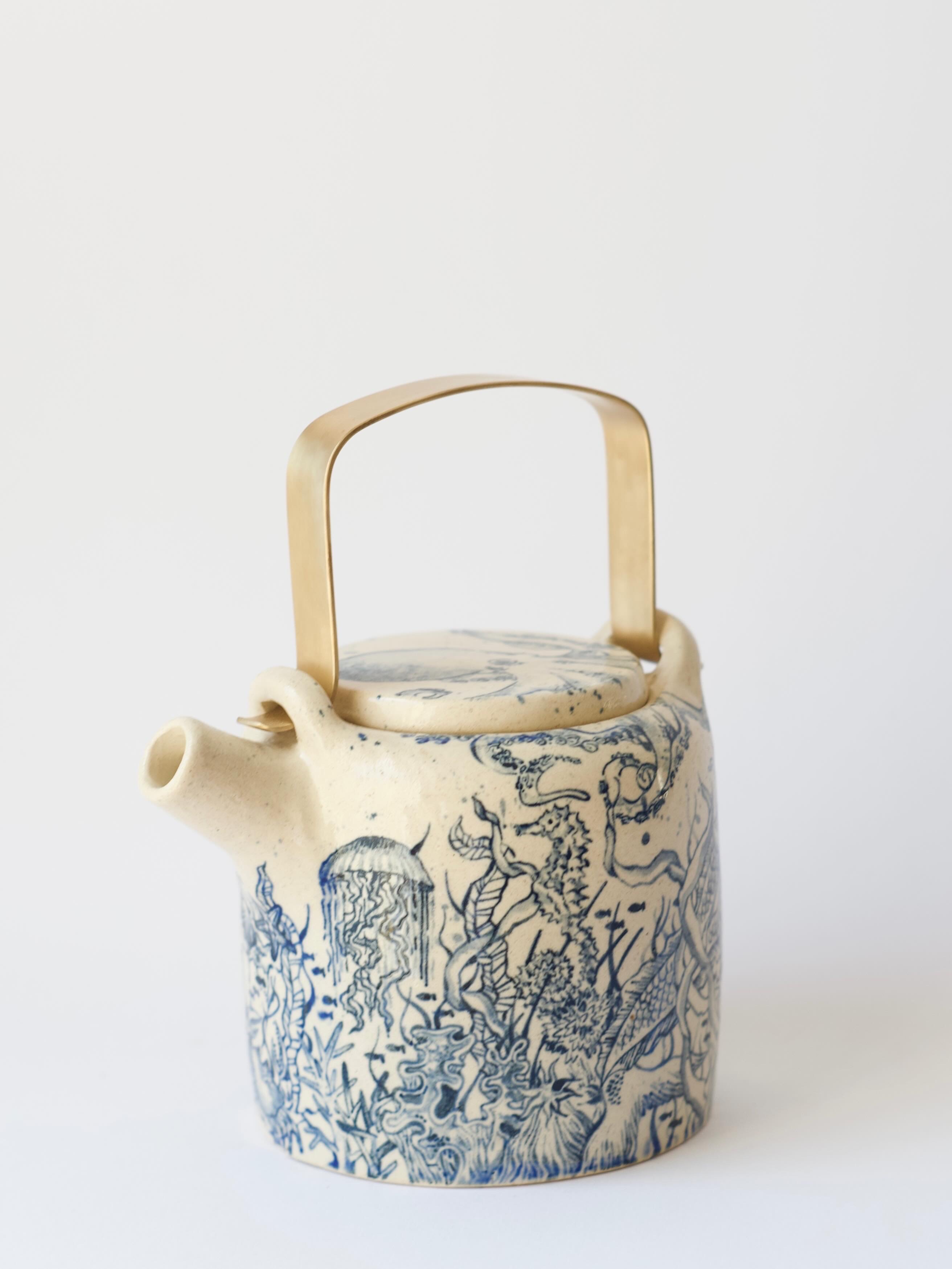 Teapot with a mermaid 