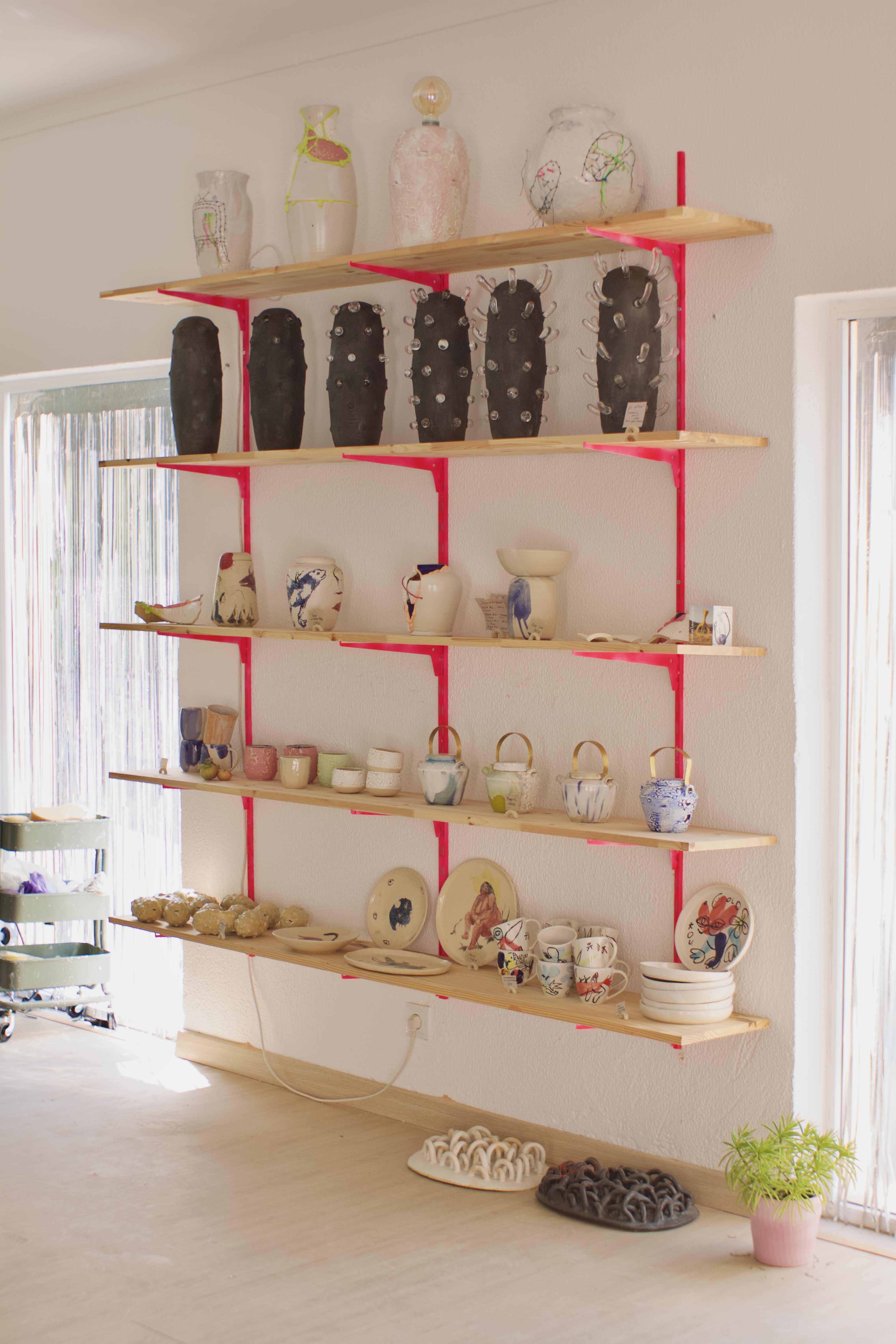 Shelves with pink brackets